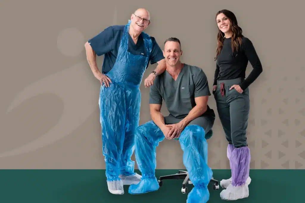 Three healthcare professionals wearing Sloan Medical PPE